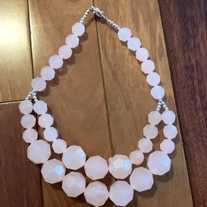 Light pink necklace.